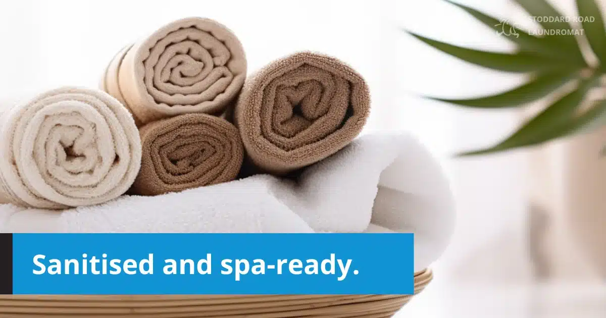 Rolled towels in a basket, clean and spa-ready.